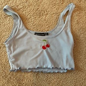 Baby blue crop top with cherries in middle